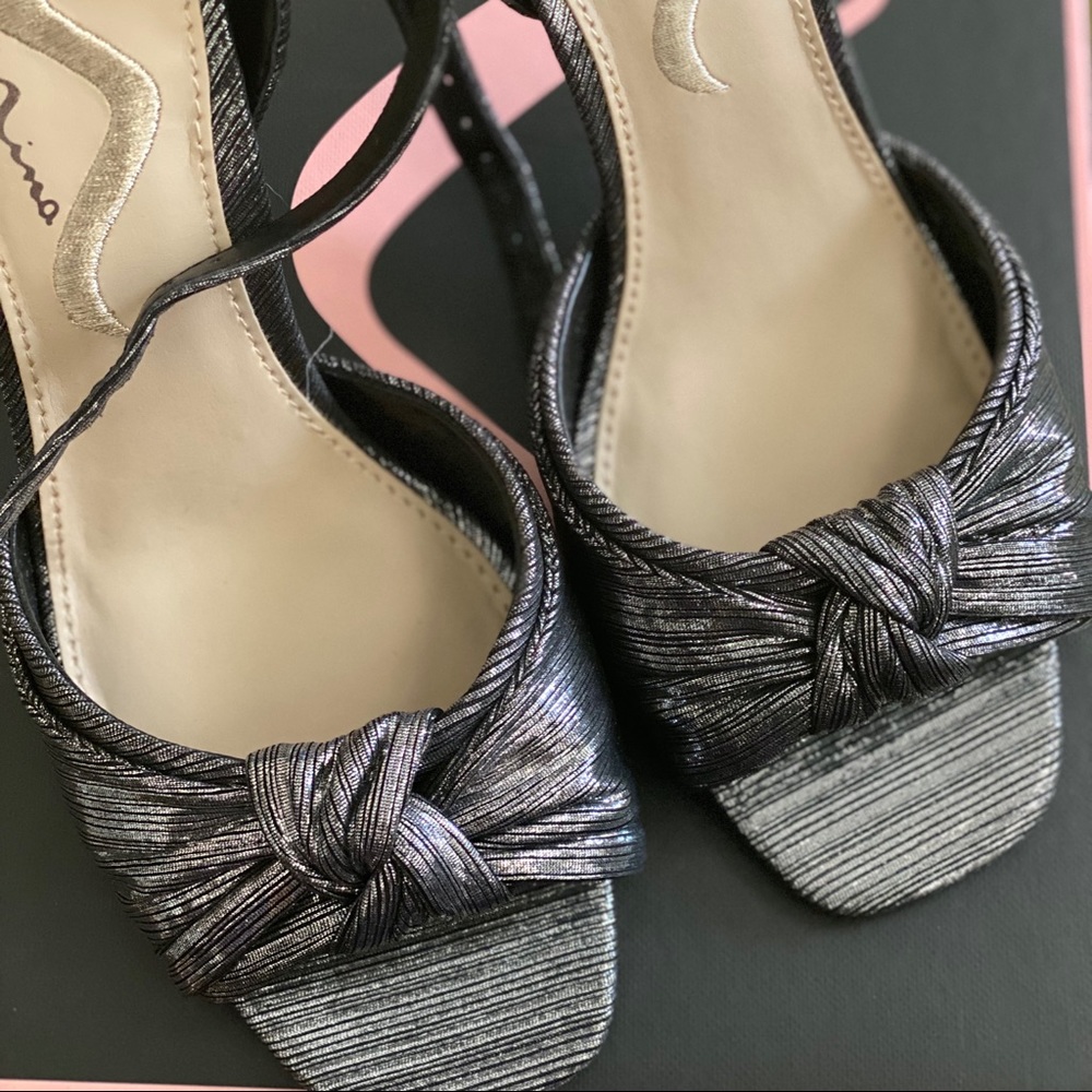 Antique silver shoes with 4” stiletto heel.